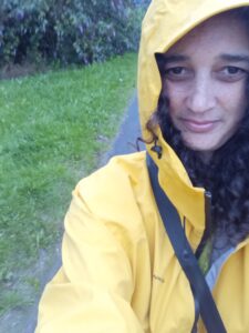 Maxine is wearing a yellow coat